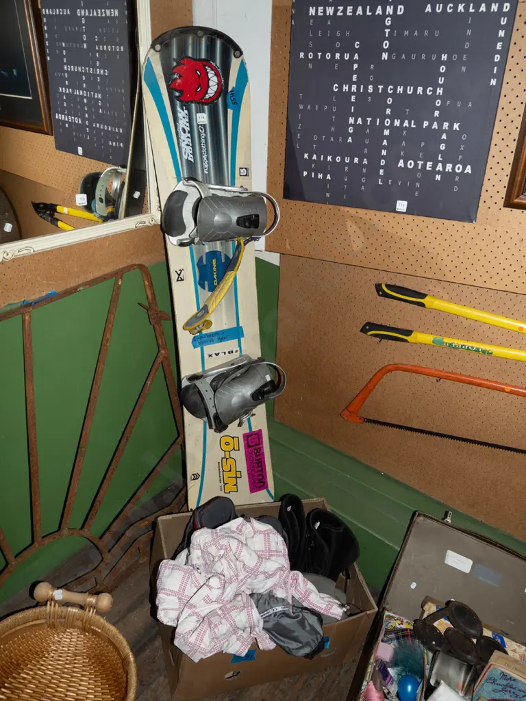 snowboard and box of accessories; jacket, boots, pants Image 1++