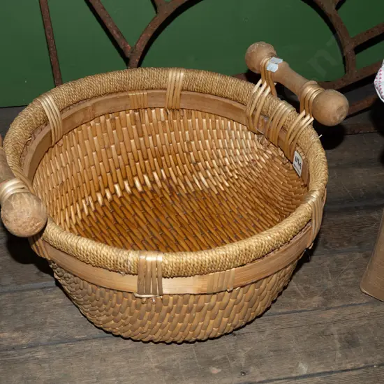 woven cane and seagrass basket with wooden handles