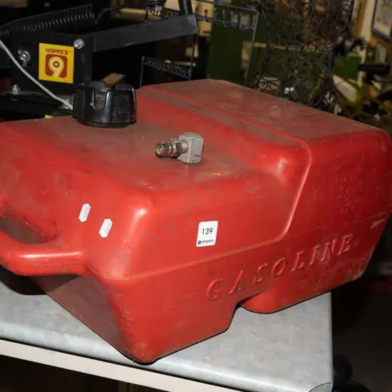 red plastic boat petrol can
