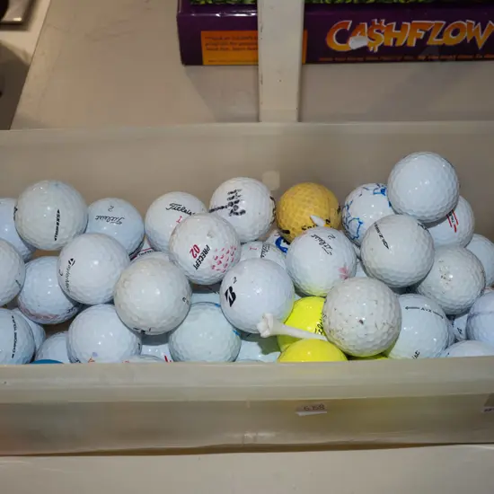 plastic tub of golf balls