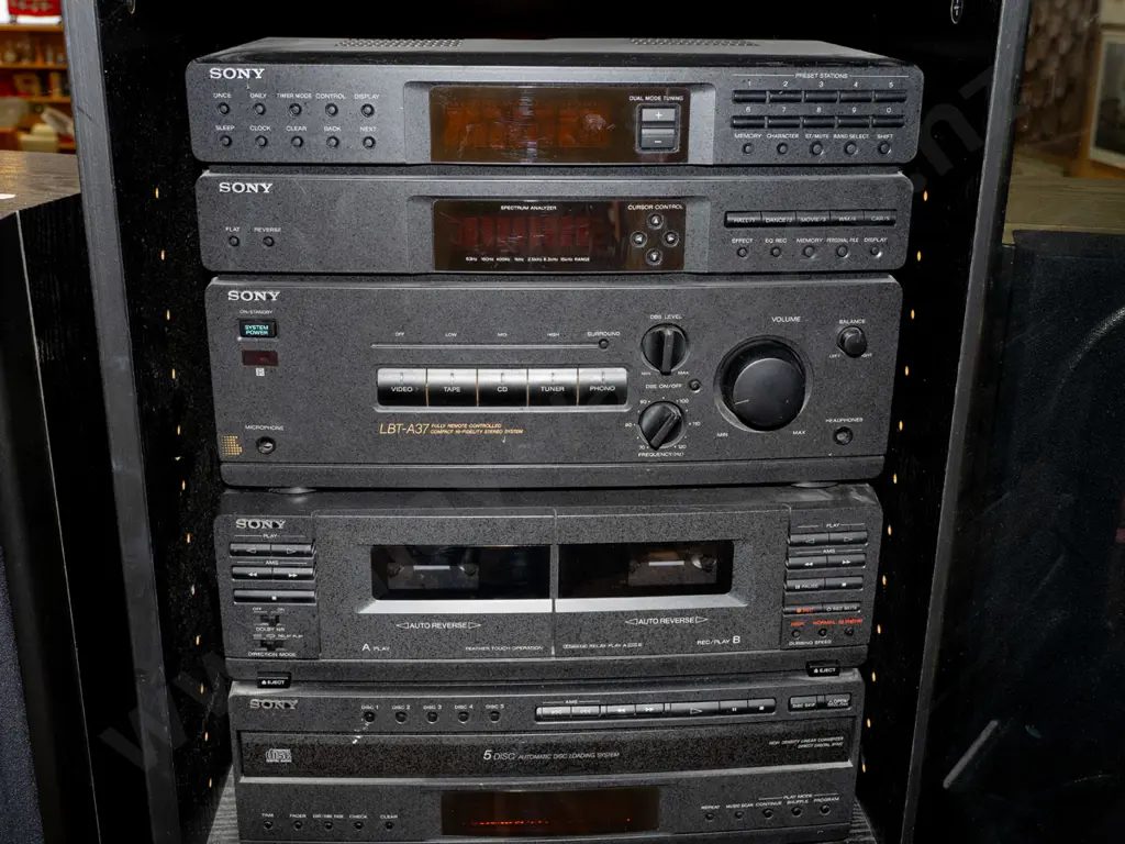Sony stereo system in cabinet Image 1++