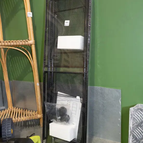 yet to be assembled black metal shelving on casters