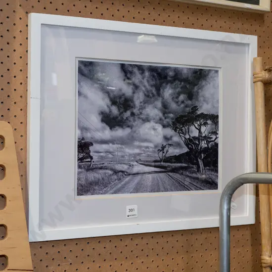 framed black and white photograph - country road