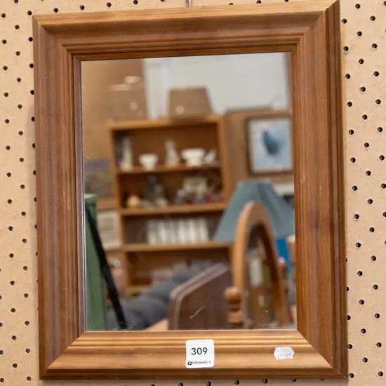 small wood framed wall mirror
