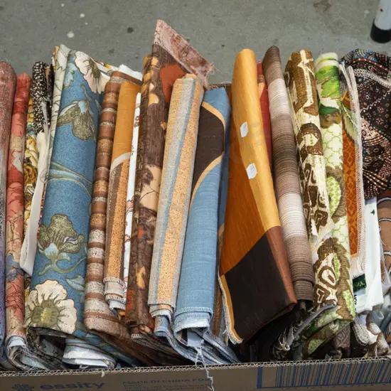 box of fabric pieces
