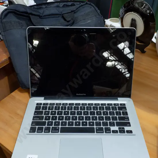 Apple Macbook Pro Model A1278 - with carry case. Password in office.