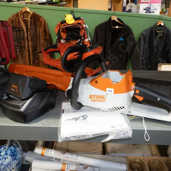 Stihl MSA 140C battery powered chainsaw with charger, battery in office