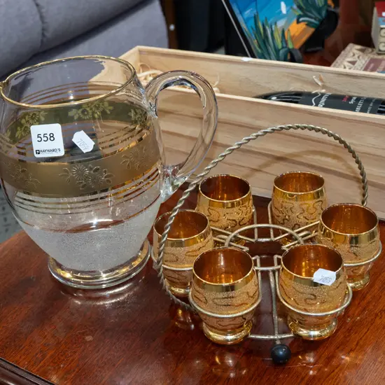 water jug, 6 amber glass tumblers in caddy