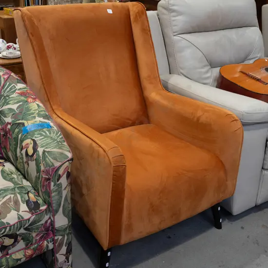 orange rust upholstered wingback chair