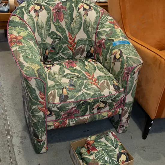 floral and toucan patterned upholstered tub chair