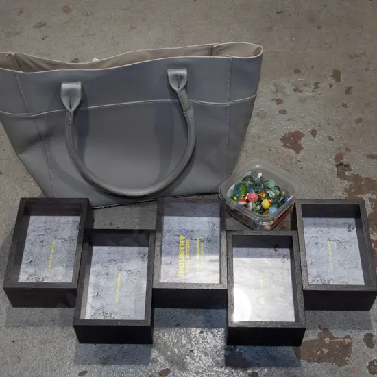 hand bag, photo frames, tub of marbles
