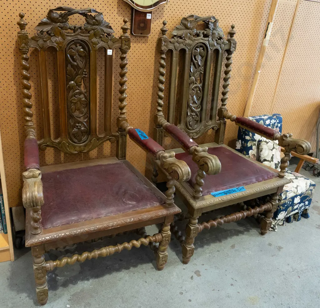 pair of ornately carved oak and red vinyl upholstered armchairs - purportedly ex Larnach Castle Image 1++