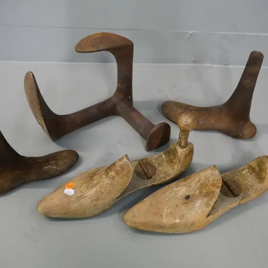 3 cast iron shoe lasts and a pair of hinged wooden shoe trees - corrosion to metal