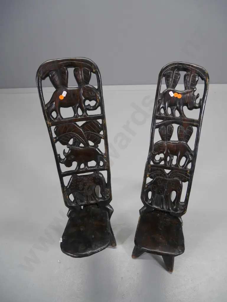pair of African heavily carved elephant motif 2-piece collapsible chairs H-700 W-170 D-600 Image 1++