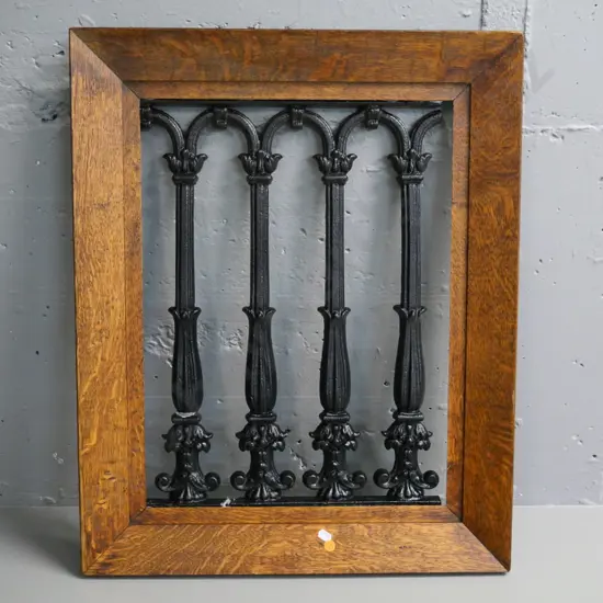 piece of cast iron balustrade in a vintage oak frame - crack to metal near bottom H-670 W-540