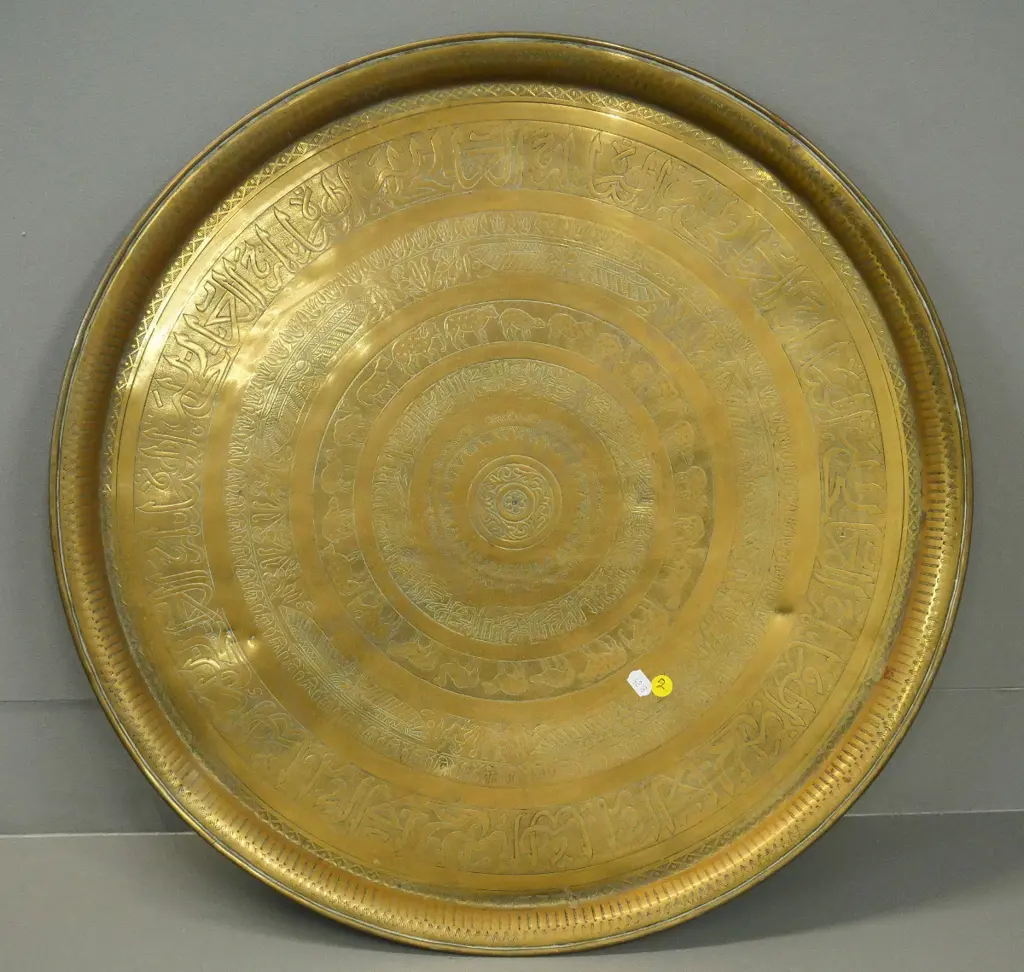 large brass tray with pressed & incised designs - some dents. Diameter 600 Image 1++