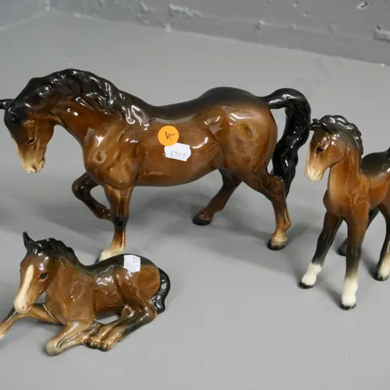 (Beswick) mare and 2 foals, one foal marked 915, mare is H-160 L-240 (1 foal has repair to leg)