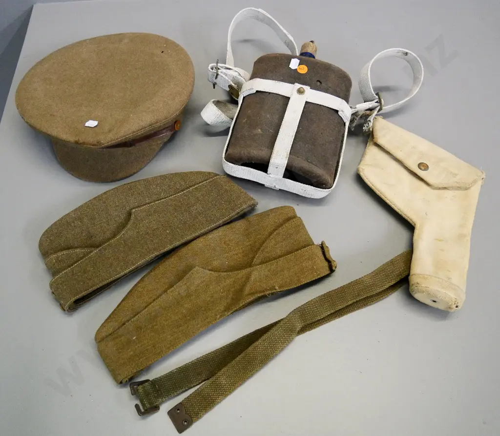 WWII era military items - 3 NZ woolen caps, canvas pistol holster, water bottle in felt jacket, etc. Image 1++