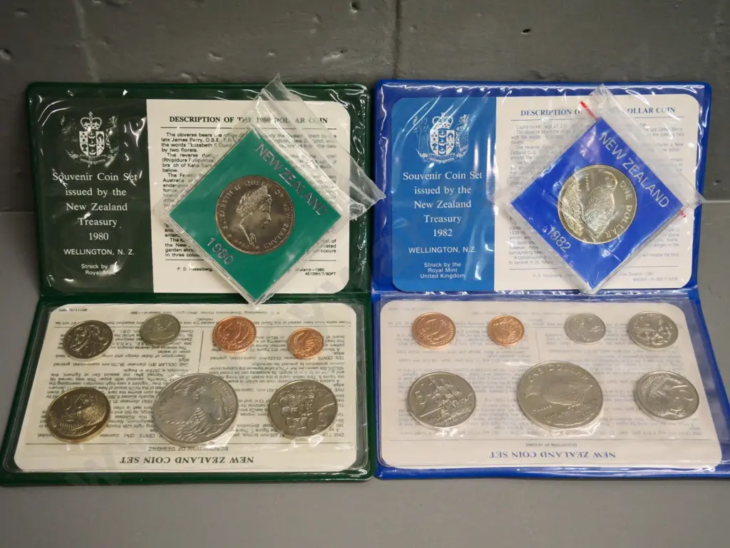 Cased New Zealand coin sets - 1980 and 1982 souvenir sets with dollar, and 2 individual dollars Image 1++