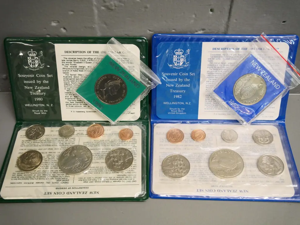 Cased New Zealand coin sets - 1980 and 1982 souvenir sets with dollar, and 2 individual dollars Image 1++