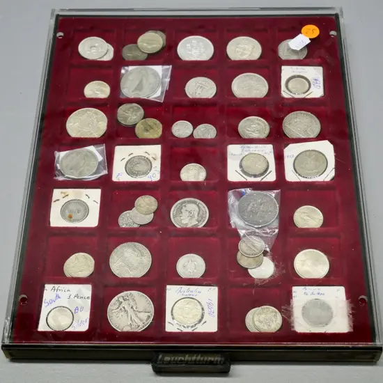 numerous overseas silver coins in plastic display case