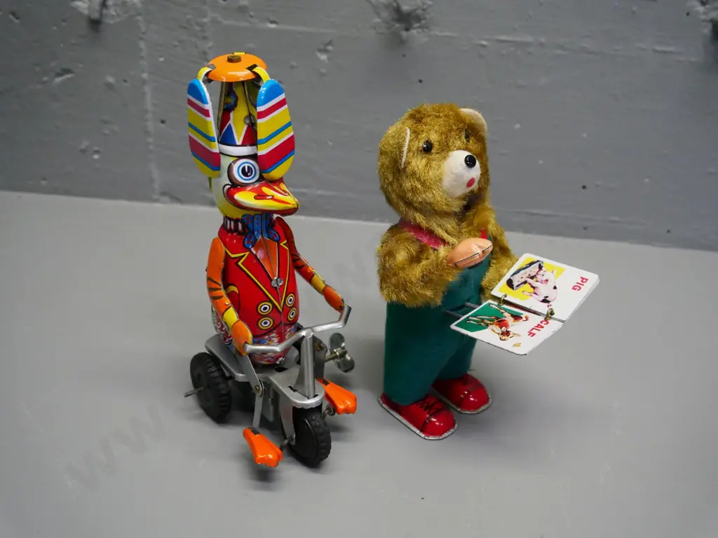 two wind-up tin toys - retro page-turning bear (not working) and reproduction duck - going, H-200 Image 1++