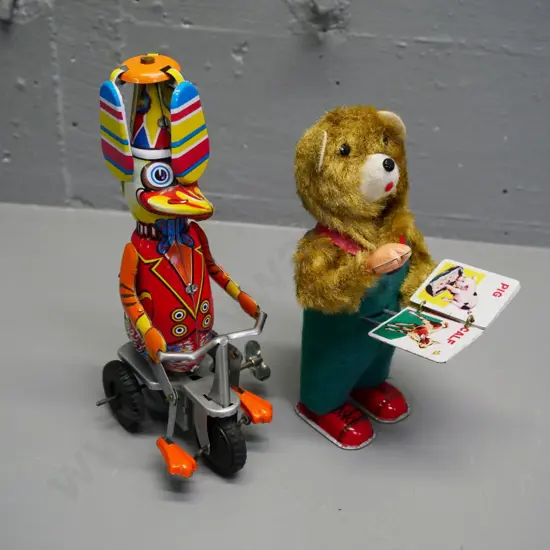 two wind-up tin toys - retro page-turning bear (not working) and reproduction duck - going, H-200