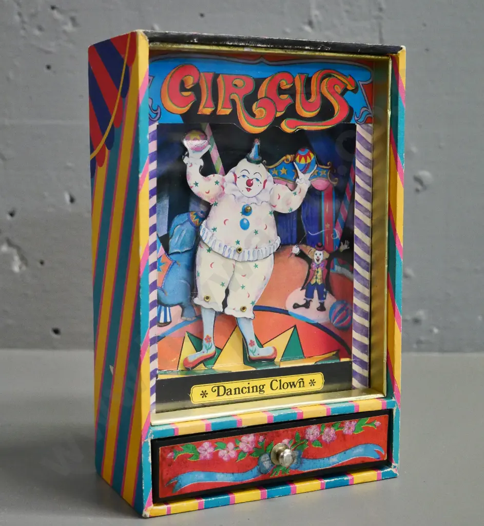 wind-up 'The Dancing Clown' music box with dancing clown figure plays It's A Small Small World tune Image 1++