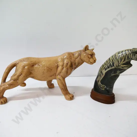 porcelain mountain lion figure H-190 L-370, no maker's mark, and a carved horn tiger on wooden base