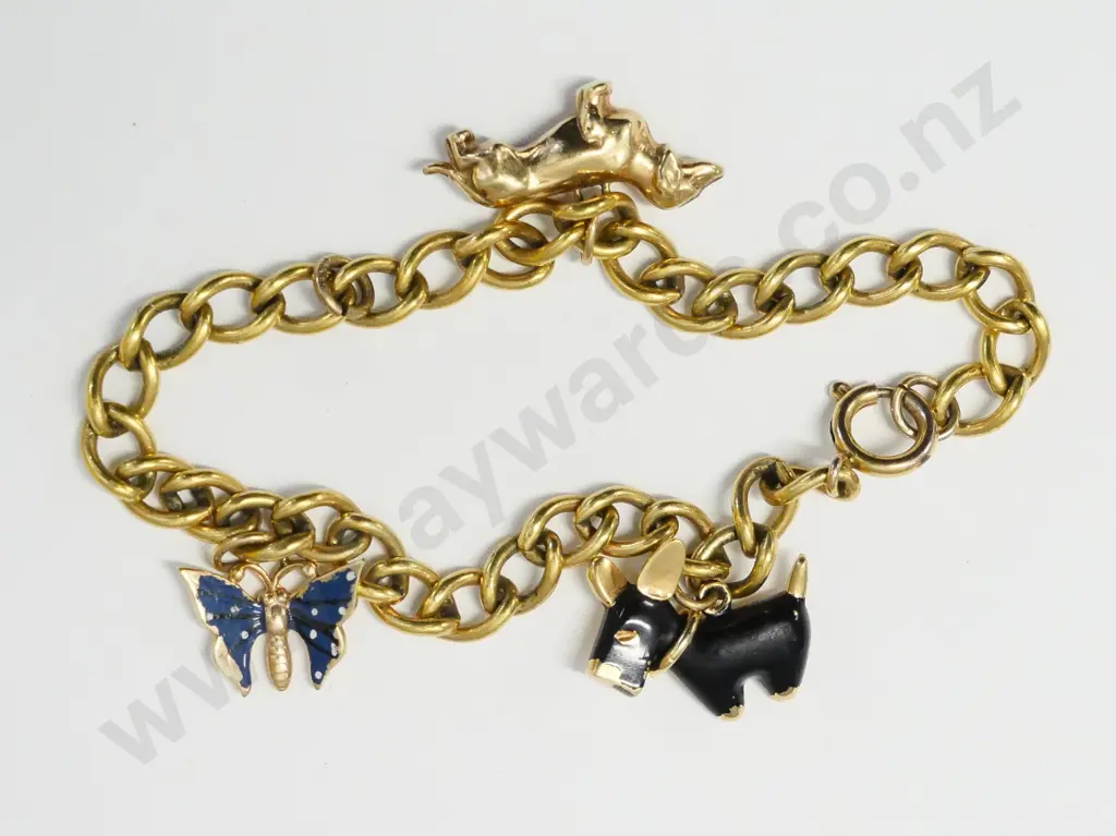 charm bracelet with 2 dogs & a butterfly no markings Image 1++