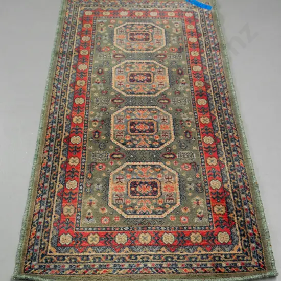 woollen floor rug - dusty greens and reds - L-1500 W-790