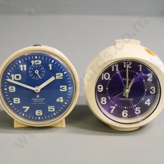 two retro wind-up plastic-cased bedside alarm clocks - Westclox Benita D-100 and Jungens Astra