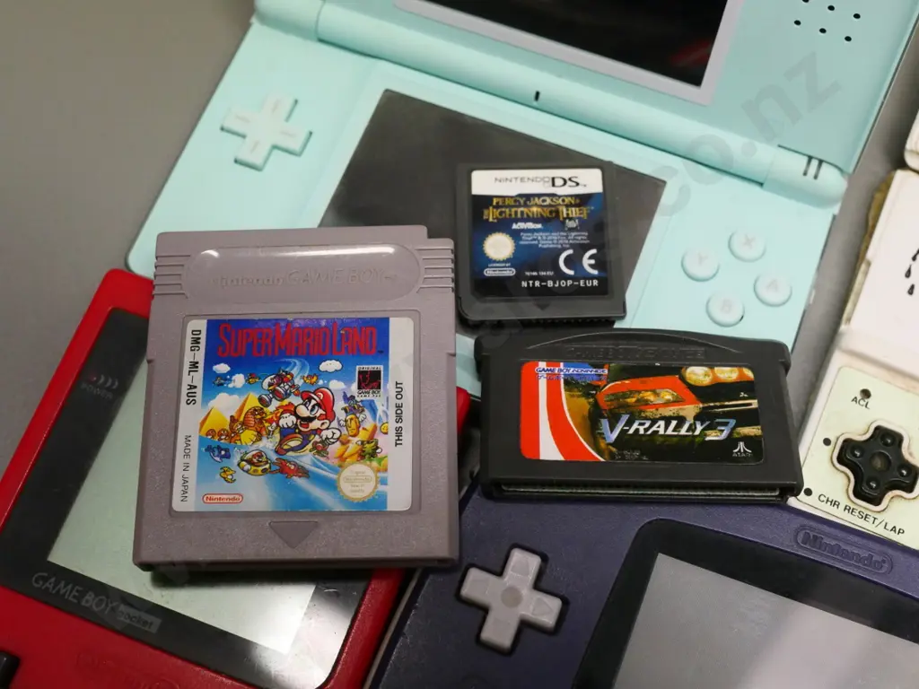 assorted hand-held video games and cartridges - Nintendo DS, Gameboy Advance etc. - untested, no returns Image 1++