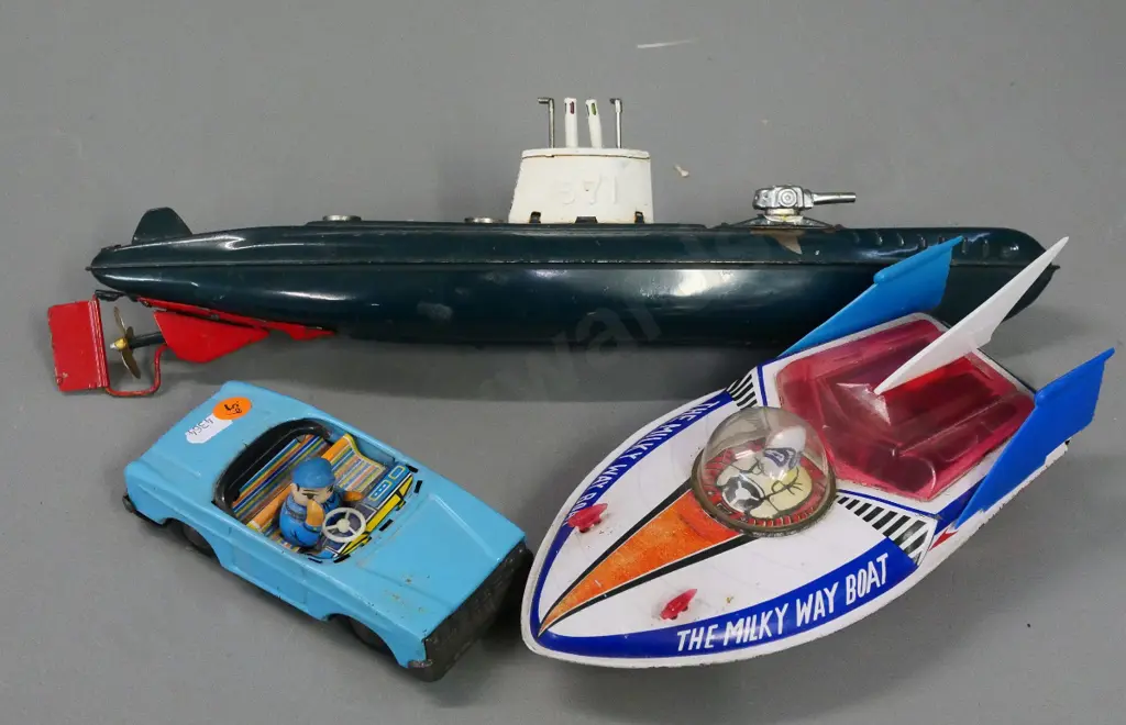 3 retro tin toy vehicles - friction drive Milky Way boat and car with waving driver, submarine may have missing parts Image 1++