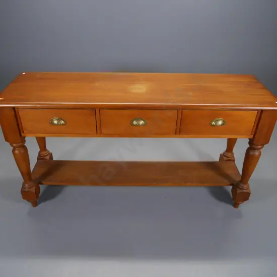 reproduction kauri 3-drawer hall table with turned legs, brass handles, bottom shelf - marks to polish H800 W1500 D450