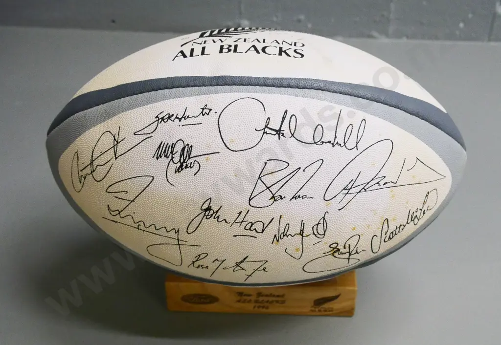 Gilbert All Blacks 1996 team souvenir rugby ball on wooden stand, printed team signatures Image 1++
