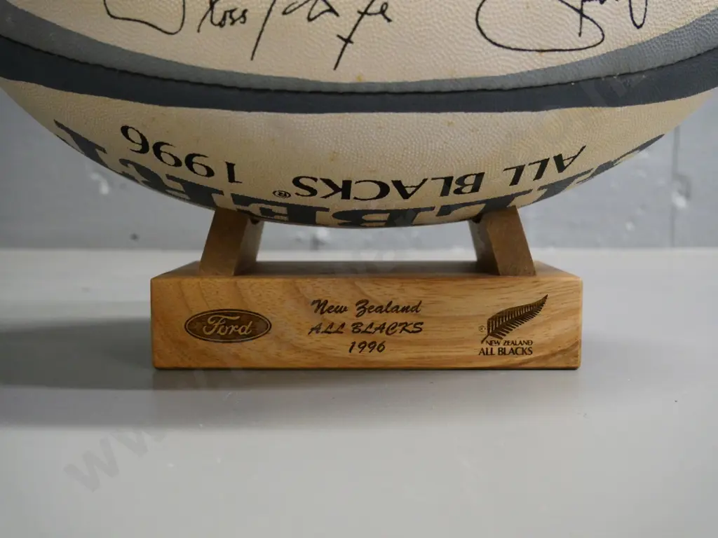 Gilbert All Blacks 1996 team souvenir rugby ball on wooden stand, printed team signatures Image 1++