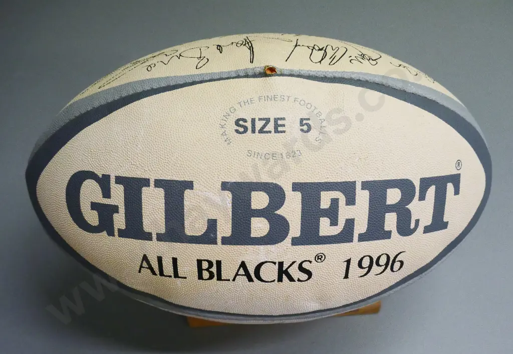 Gilbert All Blacks 1996 team souvenir rugby ball on wooden stand, printed team signatures Image 1++