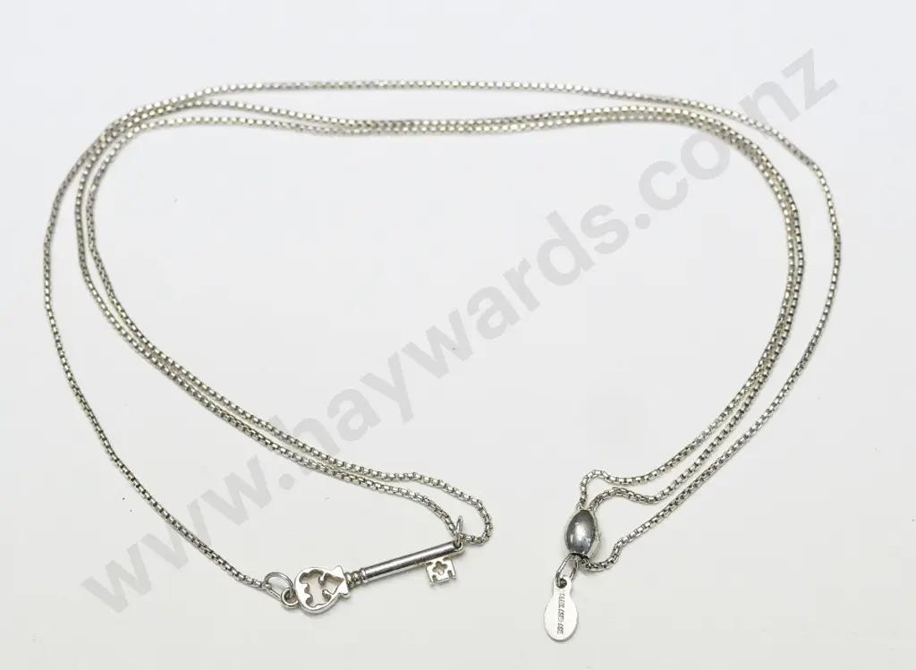silver necklace stamped Patent Pending Image 1++