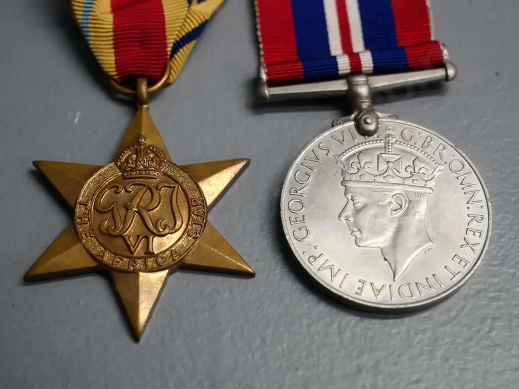 2 WWII military medals with ribbon - African star and a 1939-45 service medal Image 1++