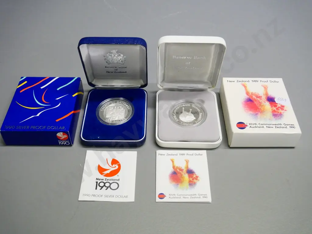 2 cased 1990 New Zealand dollar proof coins - Treaty of Waitangi & Commonwealth Games Image 1++