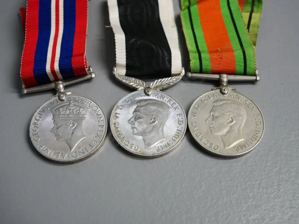3 WWII military medals with ribbon - Defense medal, New Zealand medal, and a 1939-45 service medal Image 1++
