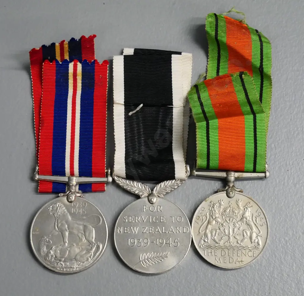 3 WWII military medals with ribbon - Defense medal, New Zealand medal, and a 1939-45 service medal Image 1++