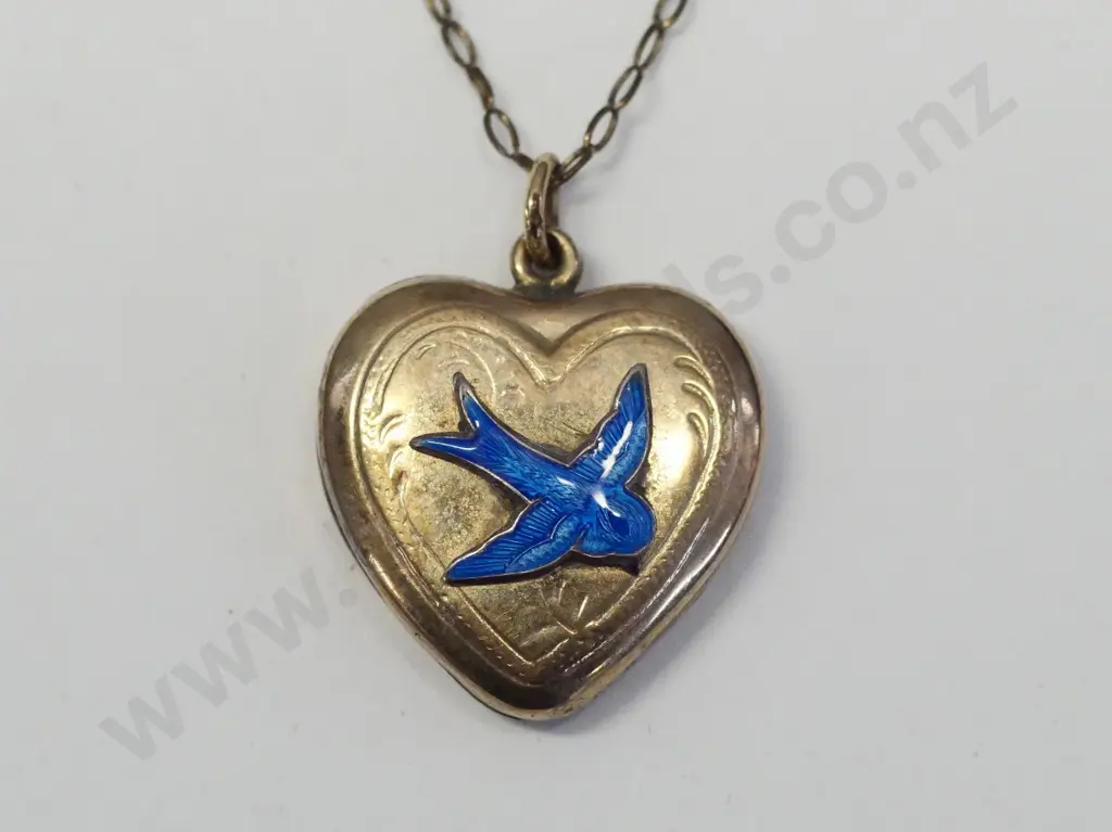 gold lined locket with blue dove stamped 9ct lnd Image 1++
