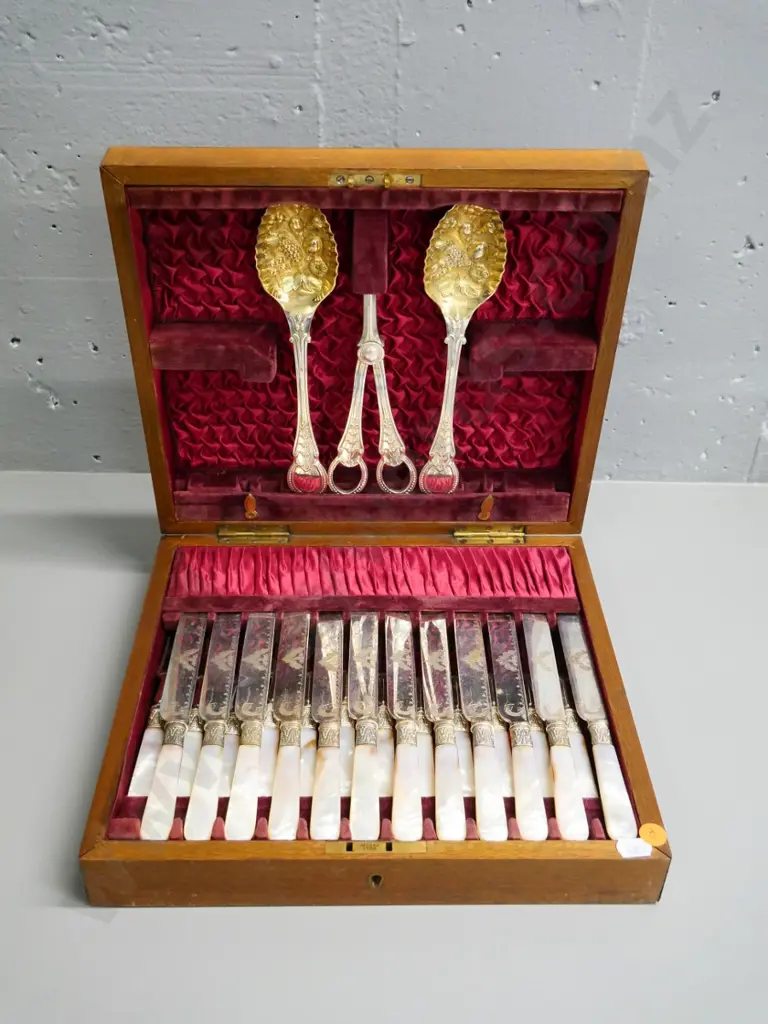 wood-cased 12-place mother-of-pearl handled dessert knives and forks, grape scissors and 2 berry spoons Image 1++