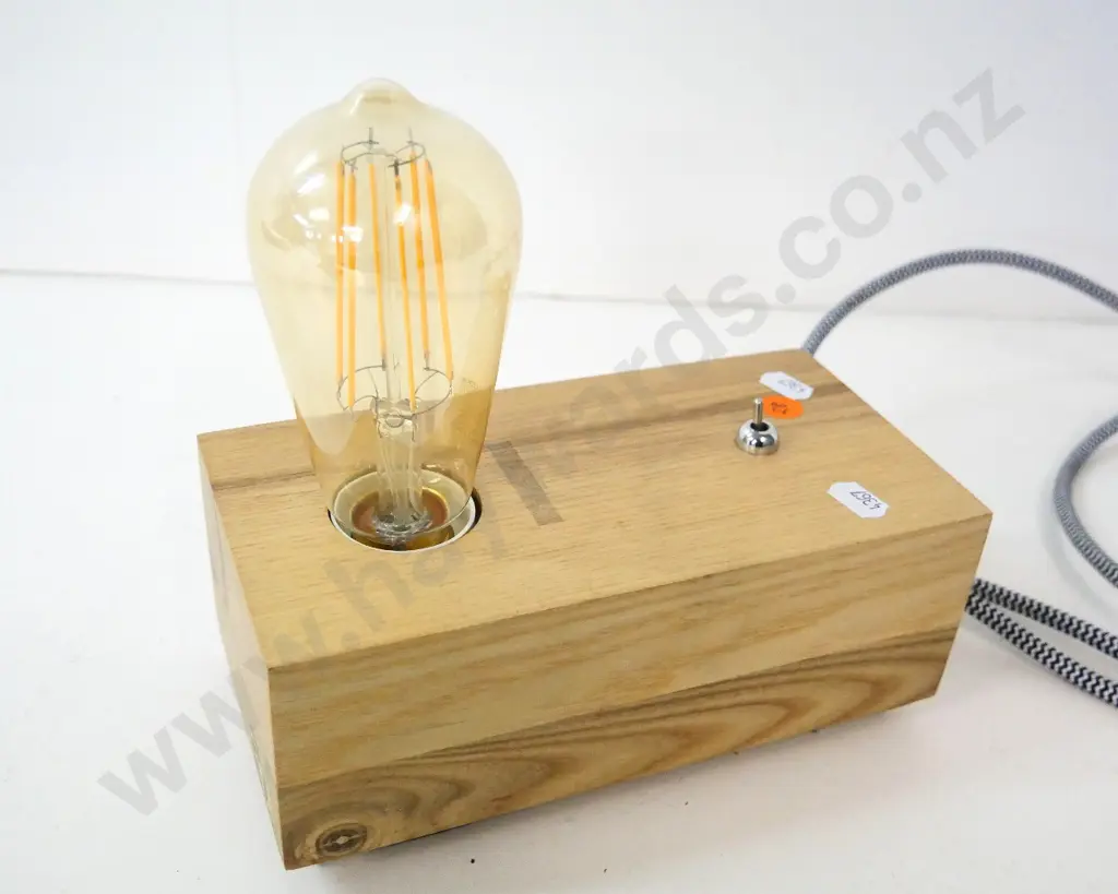 contemporary wooden table lamp with exposed bulb - some adhesive residue H-200 L-200 Image 1++