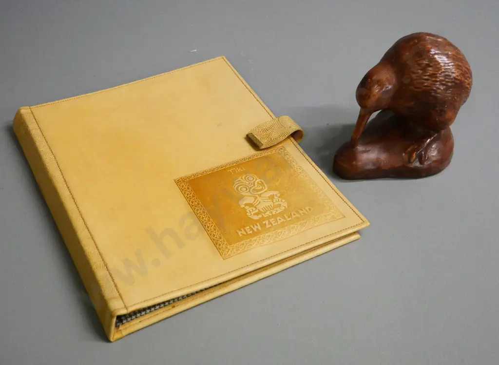 pottery kiwi figure H-100 and a tiki themed leather writing folder H-240 W-190 Image 1++