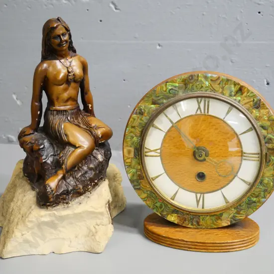 composite Pania of the Reef figurine H-250 and a mantel clock with wood and paua frame