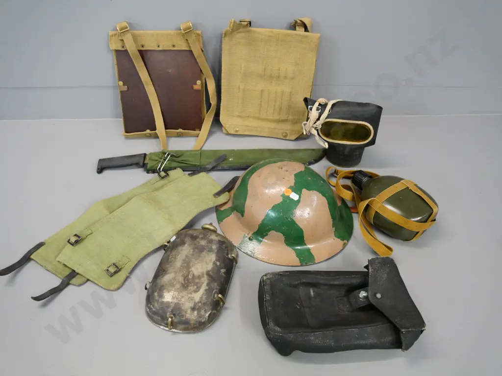 WWII era military equipment - tin helmet, gas mask, puttees, water bottle, rusty machete, etc. Image 1++