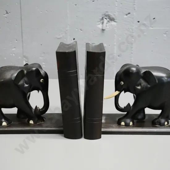 pair of ebony elephant book-ends with hidden sliding compartments - only one tusk, 3 are missing H-170 L-210